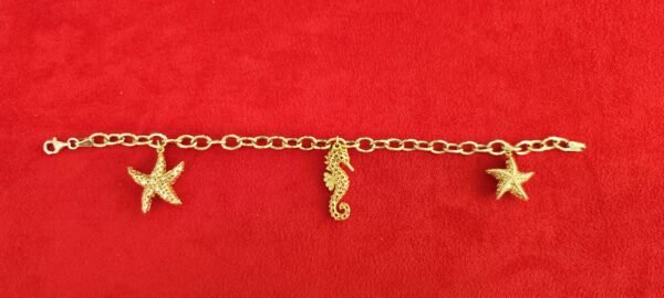 PULSERA CON COLGANTES EN ORO 18K